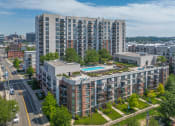 Thumbnail 45 of 46 - an aerial view of a building with a pool in the middle