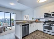 Thumbnail 3 of 46 - kitchen with stainless steel appliances and living room