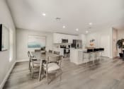 Thumbnail 11 of 29 - Pet-Friendly Rentals in Lady Lake, FL – The Groves at Lake Ella - dining room and kitchen with a table and chairs