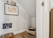 Thumbnail 27 of 45 - A dog's room with a chalkboard sign that says "bone appetit" and a dog bed.