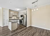Thumbnail 12 of 48 - Bright Hawks Landing kitchen with full stainless-steel appliance package and spacious island seating