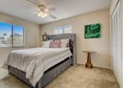 Thumbnail 8 of 15 - Derby Park Apartments in Daytona Beach, FL photo of the master bedroom has a comfy bed and a ceiling fan