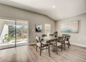 Thumbnail 13 of 29 - Lady Lake, FL Rentals – The Groves at Lake Ella - a dining room with patio doors and a table and chairs