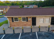 Thumbnail 15 of 17 - a view of the front of a brick building with a parking lot