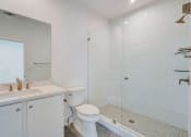 Thumbnail 7 of 14 - Luxury Three Bedroom Townhomes in Avondale Estates, GA – Henley Avondale –white bathroom with a shower toilet and sink