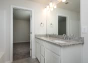 Thumbnail 12 of 25 - Pine Ridge Place Rental Home with granite countertops in bathroom