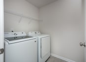 Thumbnail 13 of 25 - Pet Friendly Homes For Rent In Fountain Inn SC - Pine Ridge Place - Laundry Room With Washer And Dryer and Wide Shelf
