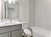 Thumbnail 22 of 23 - a bathroom with a sink toilet and bathtub