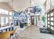 Thumbnail 11 of 23 - a large room with tables and chairs and a mural on the wall
