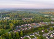 Thumbnail 17 of 17 - an aerial view of a neighborhood with houses and trees
