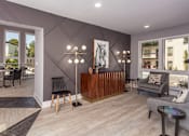 Thumbnail 18 of 34 - A modern living room with a wooden coffee table and grey sofa.