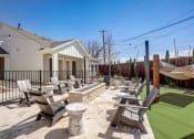 Thumbnail 49 of 56 - the retreat at thousand oaks clubhouse patio with picnic tables and hammock