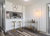 Thumbnail 9 of 20 - Kitchen and dining area at Idlewild 45 Apartments in Memphis featuring breakfast bar and stainless steel appliances