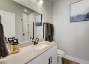 Thumbnail 25 of 56 - a bathroom with a sink and a toilet