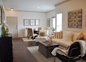 Thumbnail 13 of 33 - Living room with wood flooring and couches and windows with blinds