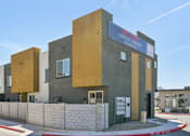 Thumbnail 44 of 45 - A modern building with a combination of beige and grey exterior walls.