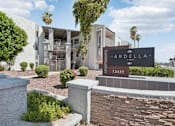 Thumbnail 17 of 34 - The image shows a building with a sign that reads "Ardella Apartments 12435".