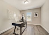 Thumbnail 18 of 29 - Houses in Lady Lake for Rent – The Groves at Lake Ella - an office space with desk and chair and window.