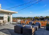 Thumbnail 31 of 50 - rooftop deck with lounge chairs and view
