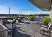 Thumbnail 30 of 50 - rooftop deck with BBQ and sitting areas