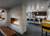 Thumbnail 27 of 50 - resident lounge with gas fireplace and kitchen