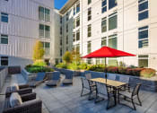 Thumbnail 38 of 50 - courtyard deck with tables and seating