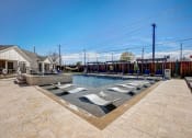 Thumbnail 53 of 56 - the preserve at ballantyne commons pool and spa with lounge chairs and a pool
