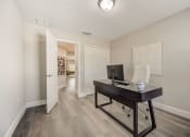 Thumbnail 19 of 29 - Lady Lake, FL Rentals – The Groves at Lake Ella - an office space with desk and chair.