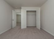 Thumbnail 14 of 25 - a bedroom with two closets and two doors