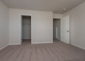 Thumbnail 18 of 25 - a bedroom with a closet and an open door