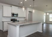 Thumbnail 4 of 25 - Pine Ridge Place Rental Home. Large Kitchen Island