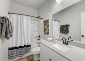 Thumbnail 24 of 56 - a bathroom with a sink and a toilet