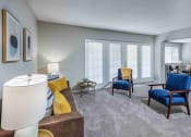 Thumbnail 3 of 40 - Grand Arbor Reserve Apartments in Raleigh, NC photo of a living room with large windows