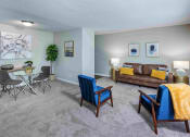 Thumbnail 2 of 40 - Grand Arbor Reserve Apartments in Raleigh, NC photo of a living room with dining room