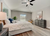 Thumbnail 22 of 29 - Lady Lake, FL Rentals – The Groves at Lake Ella - the master bedroom has a large bed and a ceiling fan