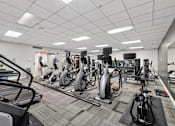 Thumbnail 57 of 66 - A gym with a variety of exercise equipment.