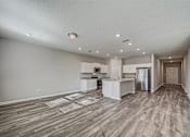 Thumbnail 9 of 21 - an empty kitchen and living room