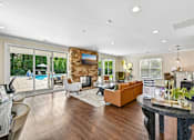 Thumbnail 45 of 48 - A stylish Hawks Landing clubroom in Hickory NC featuring a fireplace with views of the pool outside