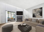 Thumbnail 5 of 16 - Greentree Apartments in Savannah, GA photo of a living room with a couch and a coffee table