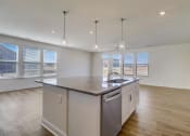 Thumbnail 18 of 20 - a kitchen and living room with a large island