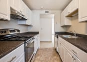 Thumbnail 8 of 48 - renovated kitchen with white cabinets and stainless steel appliances