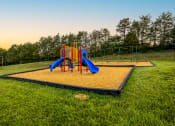 Thumbnail 3 of 17 - a playground with a swing set on a trampoline