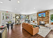 Thumbnail 42 of 48 - A modern Hawks Landing clubroom in Hickory NC featuring a cozy fireplace and comfortable seating