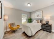Thumbnail 26 of 29 - Pet-Friendly Rentals in Lady Lake, FL – The Groves at Lake Ella -of guest bedroom with hardwood floors