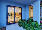 Thumbnail 27 of 36 - Front exterior of the leasing office building at Gateway Luxury Apartments with clear signage and greenery.