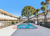 Thumbnail 13 of 15 - A swimming pool in the middle of a residential area.