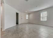 Thumbnail 41 of 56 - a large living room with a tiled floor
