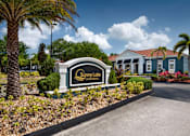 Thumbnail 28 of 28 - A Sunny Lake Apartments sign is in front of a building.