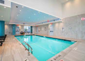 Thumbnail 28 of 31 - a swimming pool in the lobby of a hotel