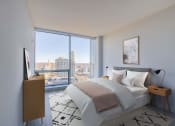 Thumbnail 8 of 31 - 3thirty3 new rochelle ny apartment high rise photo of bedroom with large windows and modern furnishings